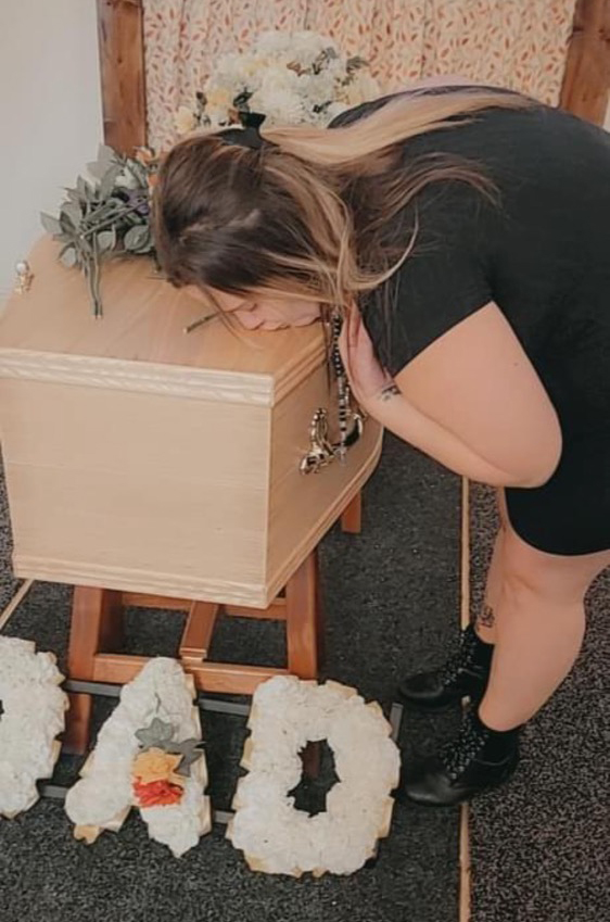 Billie-Jo Suffill, pictured kissing her dad’s coffin during a service at Legacy’s chapel, said she now wondered if he was in the casket