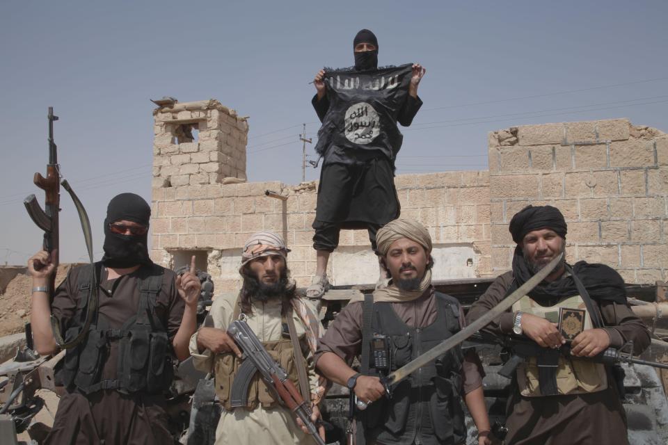 Sudan is said to have received weapons and foreign fighters when the Islamic State was defeated in Iraq in 2017; pictured are IS fighters on the Syria-Iraq border