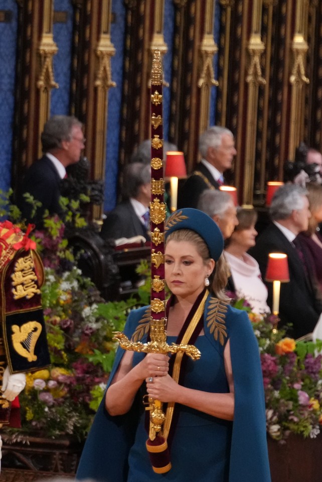 Penny Mordaunt carrying the sword of state at the King's coronation