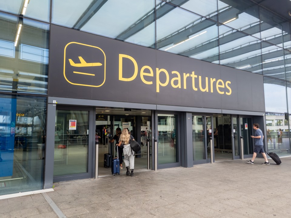 The sign for the departure hall of Gatwick Airport north terminal building