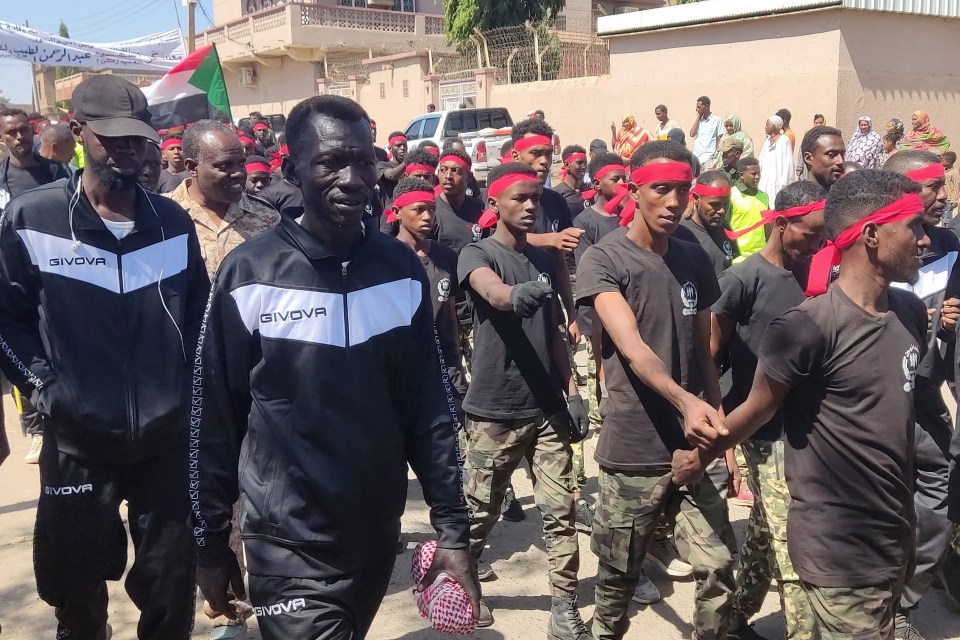 Members of the Sudanese armed popular resistance, which backs the army, parade in the streets of Gedaref in eastern Sudan earlier this month