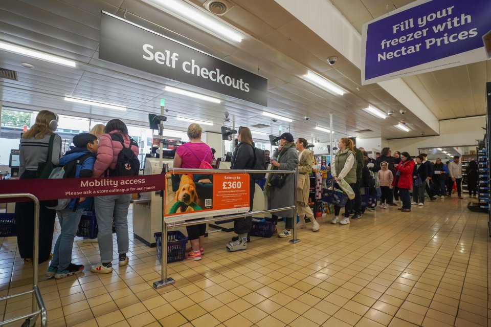 Unable to use card-only self-checkouts, shoppers jostled in line at the checkouts, like here in Richmond, West London