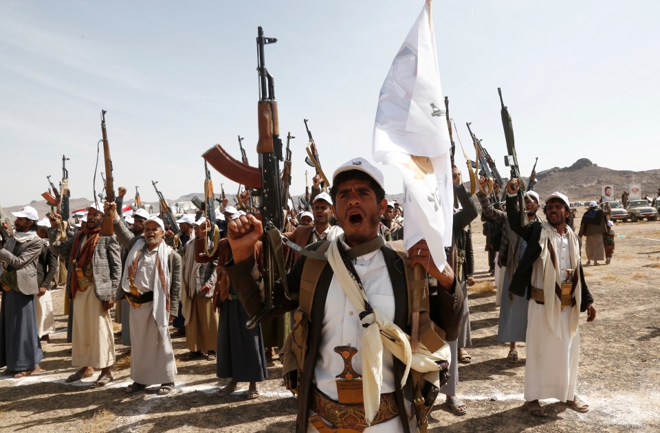 Fired up Houthi fighters in Sanaa, Yemen, lift rifles in a rally supporting Gaza