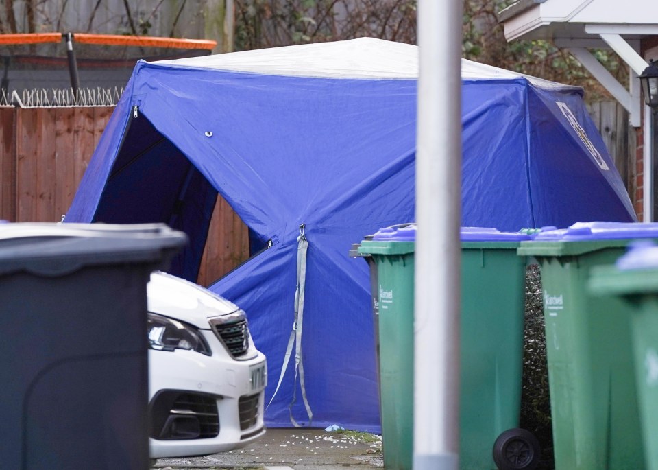 A blue tent remained up near the home yesterday morning