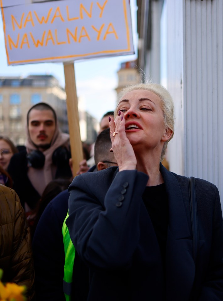 Yulia wipes away a tear during the protests in Berlin