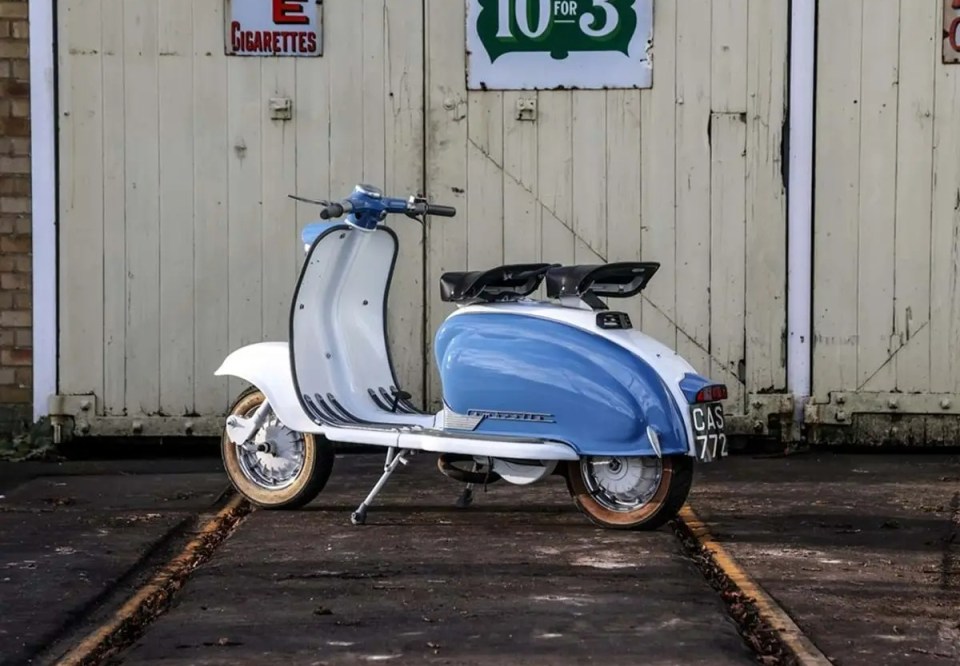 It is painted in the two-tone colours of blue and cream with matching seats