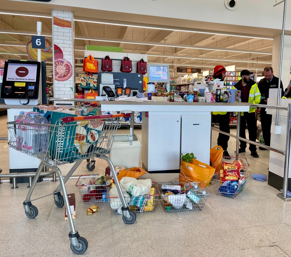 Trolleys full of grocery's were dumped at Sainsbury's in Richmond upon Thames as panicked shoppers raced to take cash out, sparking massive queues at ATMs