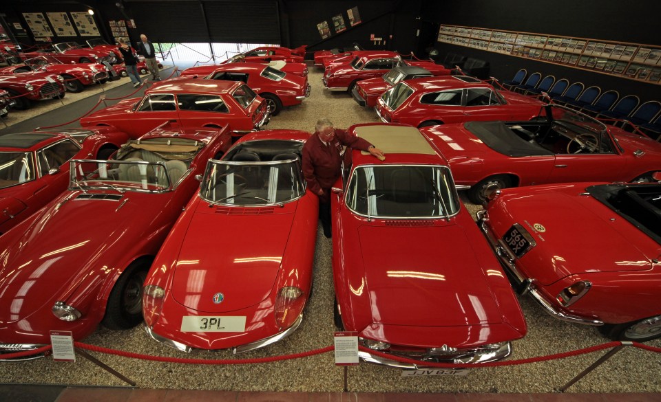 All 30 of the cars are red so visitors can focus on the shape and model of the sports cars