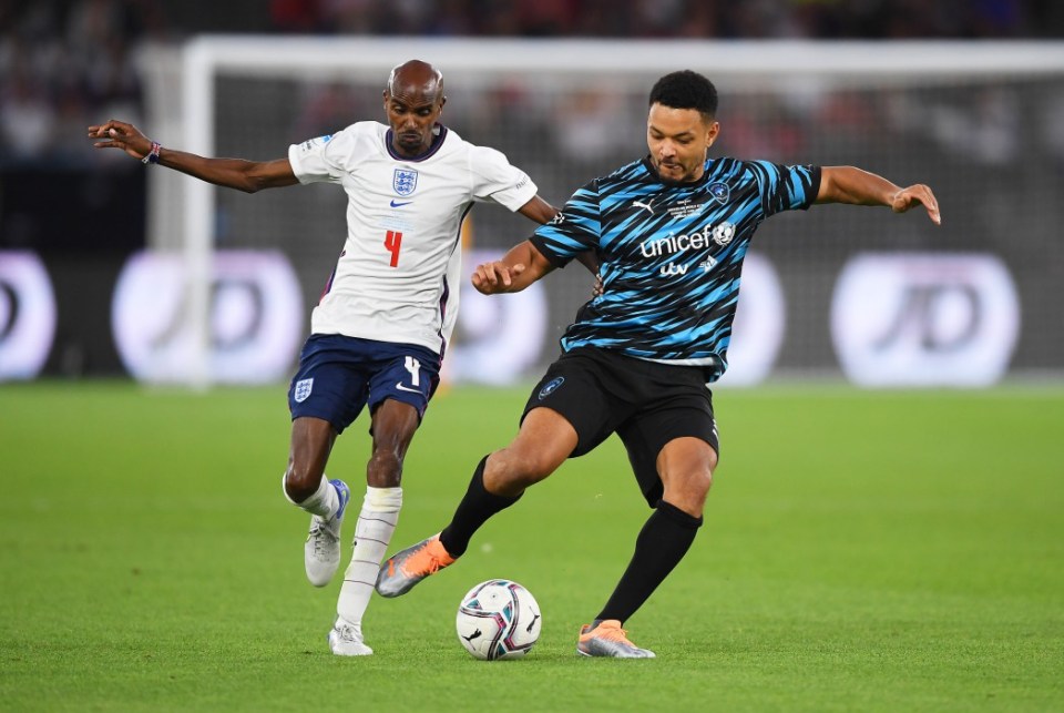 Sir Mo Farah battles for possession with Steven Bartlett during the 2022 Soccer Aid match