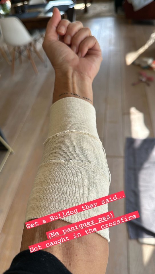 She told them ‘not to panic’ in Spanish over the snap of her arm in bandages