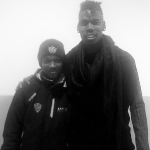 Aspiring footballer Amad poses with Paul Pogba