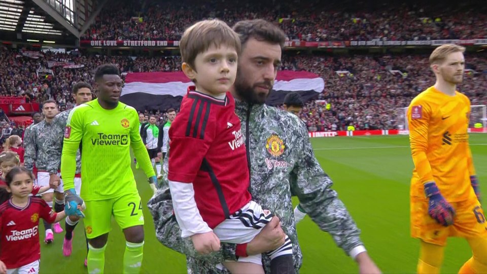 THe United skipper then carried out the youngster as the players emerged