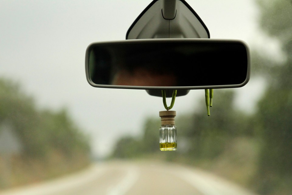 Having an air freshener in your car is not illegal but it could land you in some serious trouble with the authorities