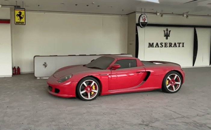 A very rare Porsche GT Carrera is front and centre – complete with red wheels and yellow calipers