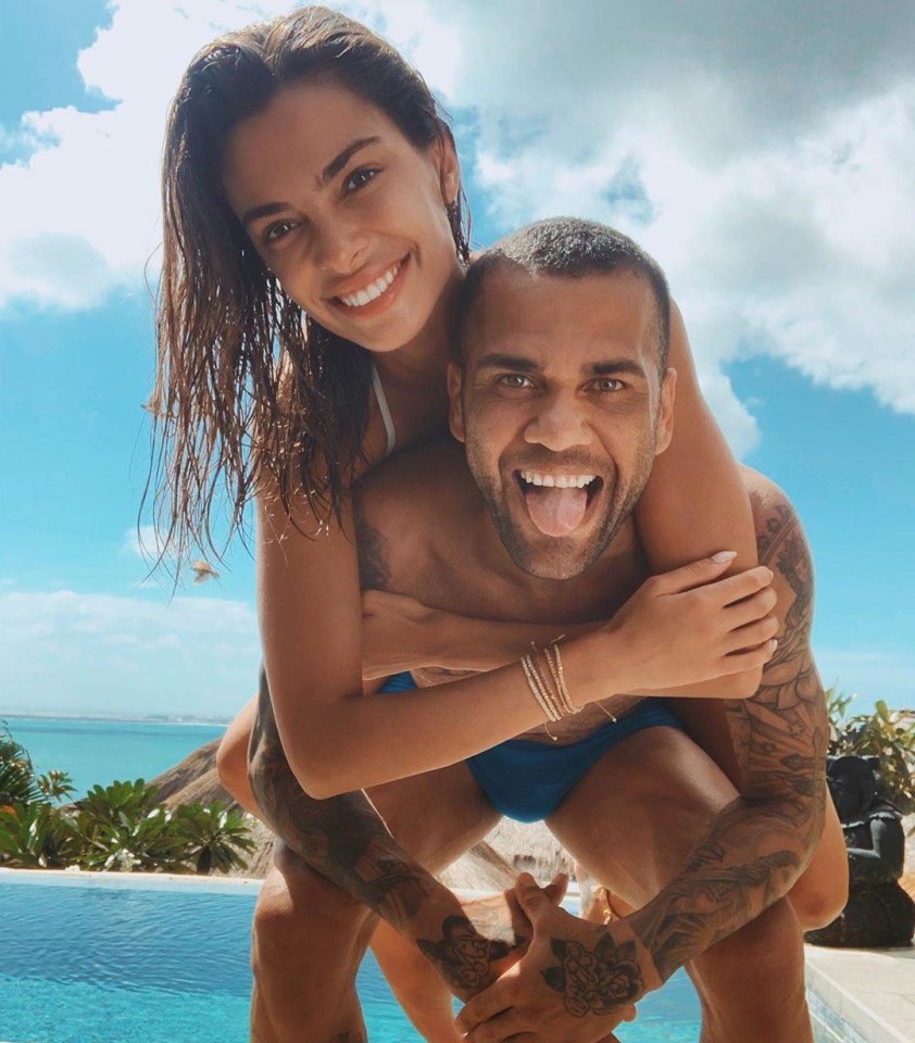 Joana Sanz and Dani Alves grin in a social media post