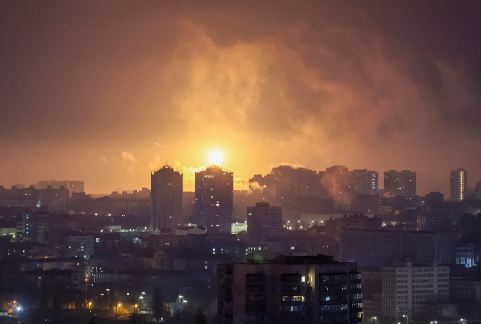 An explosion of a missile is seen in the sky over the Kiev