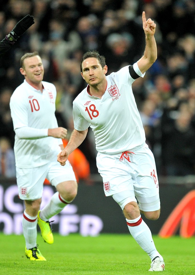 Frank Lampard celebrates the winner against Brazil with fellow scorer Wayne Rooney