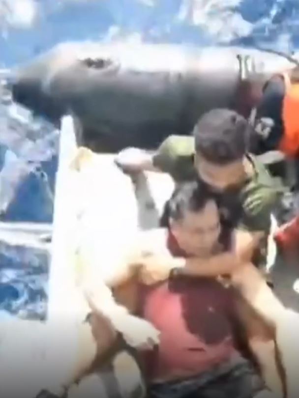 The traumatised survivors of of the US cargo ship being evacuated