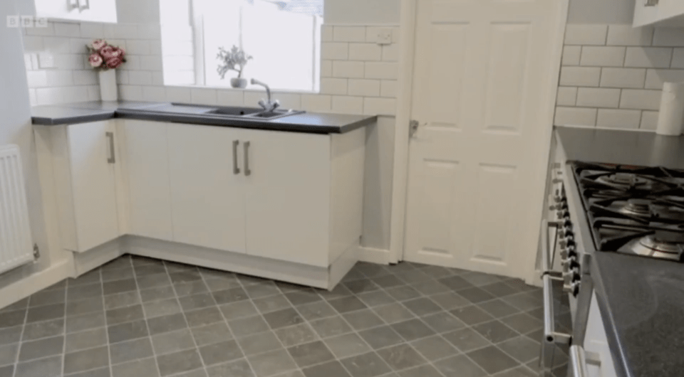 A nice clean kitchen area stands in place of the damp dispaired kitchen