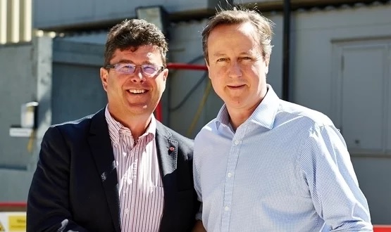 Frank Hester (left) pictured with Foreign Secretary David Cameron in 2016