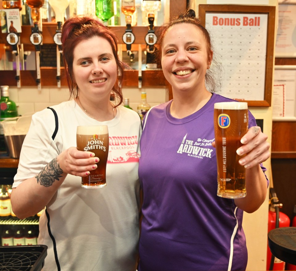 Bar staff Emma Berry (left) and Alyce Coleman (right) pull £1.80 pints to parched revellers