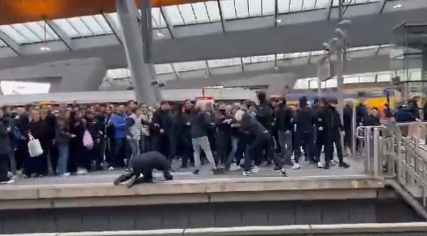 The footage shows one fan struggling to stand up after seemingly having been knocked to the ground