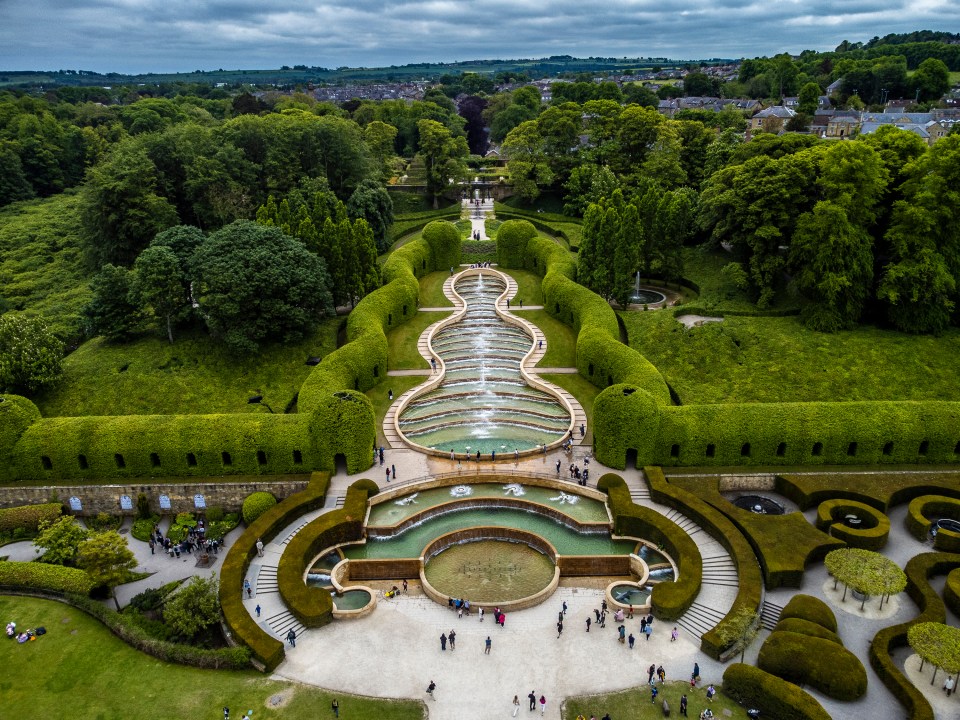 The garden's cascade fountain stretches across the park