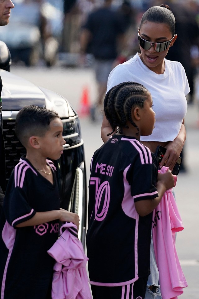 Kim with footy-mad kids Saint and Psalm on their way to an Inter Miami game