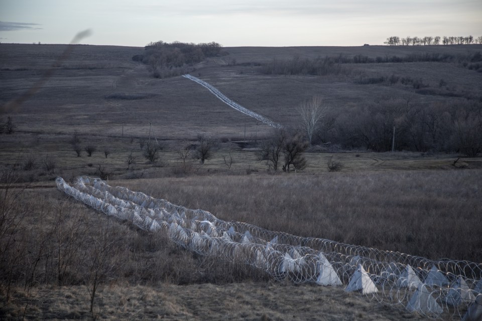 Miles of dragon's teeth anti-tank structures stretch out across the Ukrainian countryside