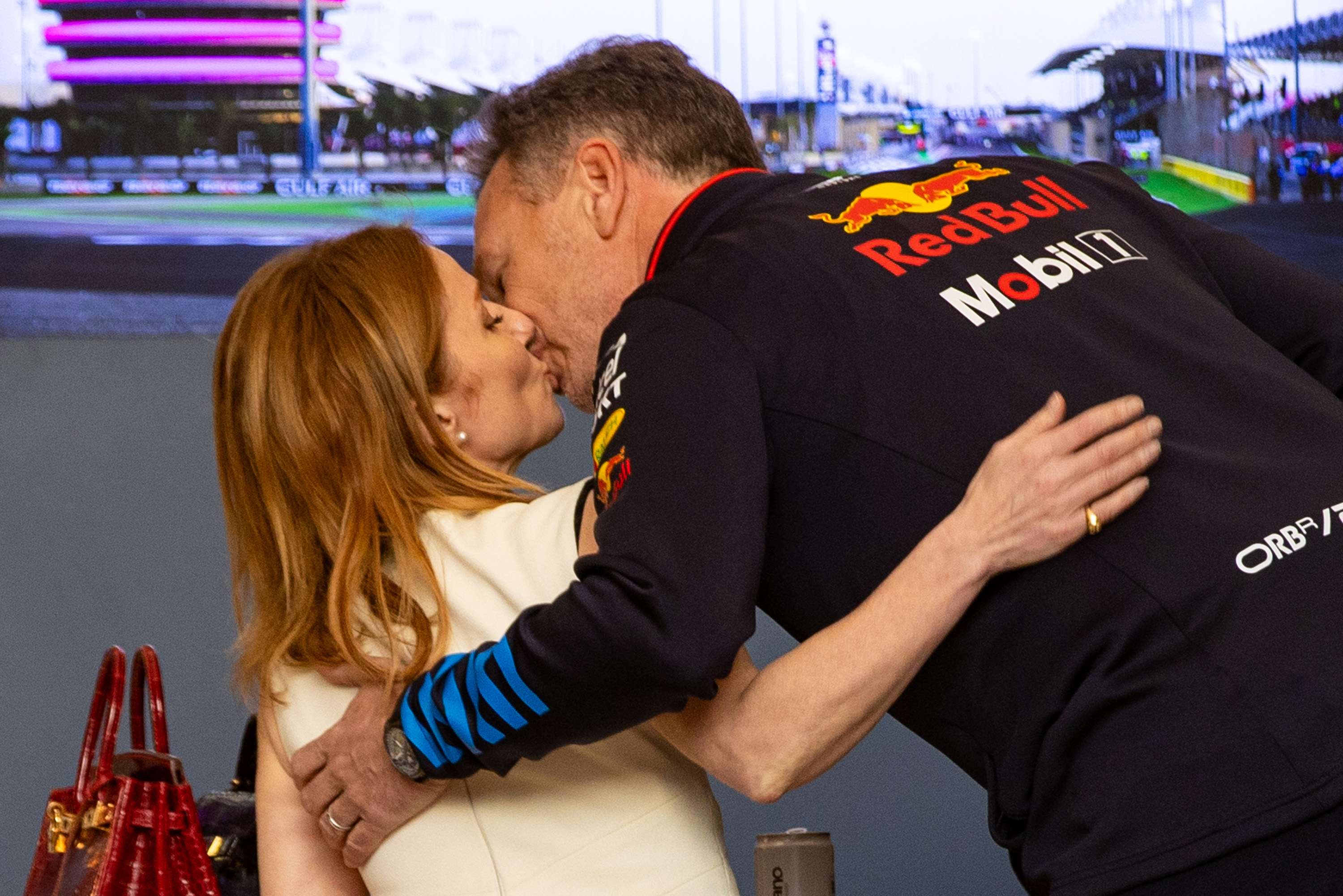 Geri and her husband share sharing an intimate moment before the opening race of the season