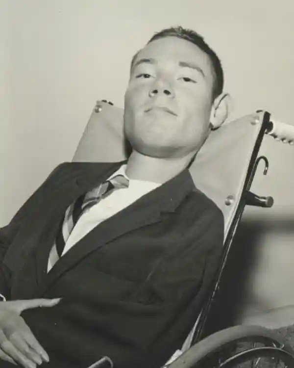 Paul learned the 'frog' breathing technique that allowed him to leave his iron lung for short periods of time - and work at a lawyer, above