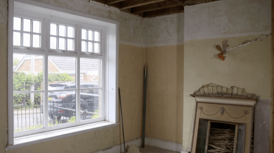 The damp infested old front room was patched up