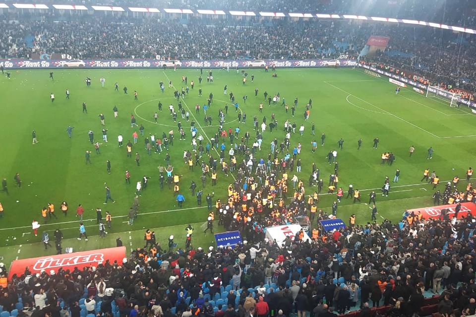 Hundreds ran onto the pitch