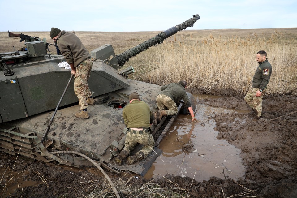 The bogged down crew set about trying to get the stuck tank back into action