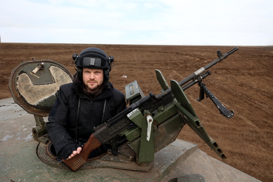 Sun man Jerome Starkey behind the machine gun on the Challenger turret