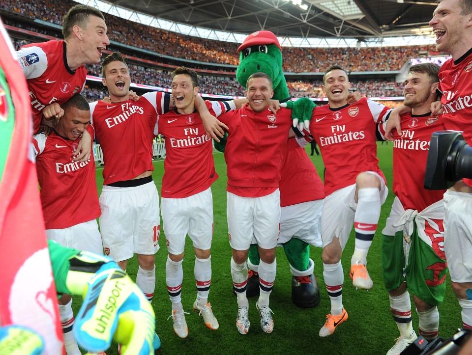 Podolski celebrates winning the 2014 FA Cup final with Arsenal after beating Hull