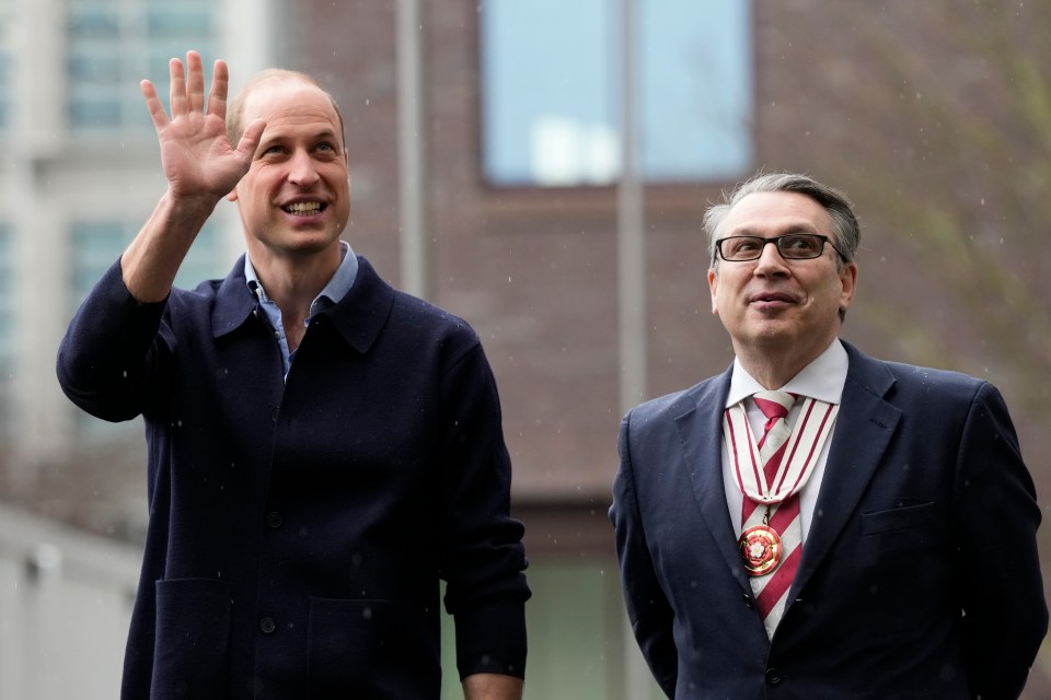 William smiled and waved at gathering crowds while chatting animatedly