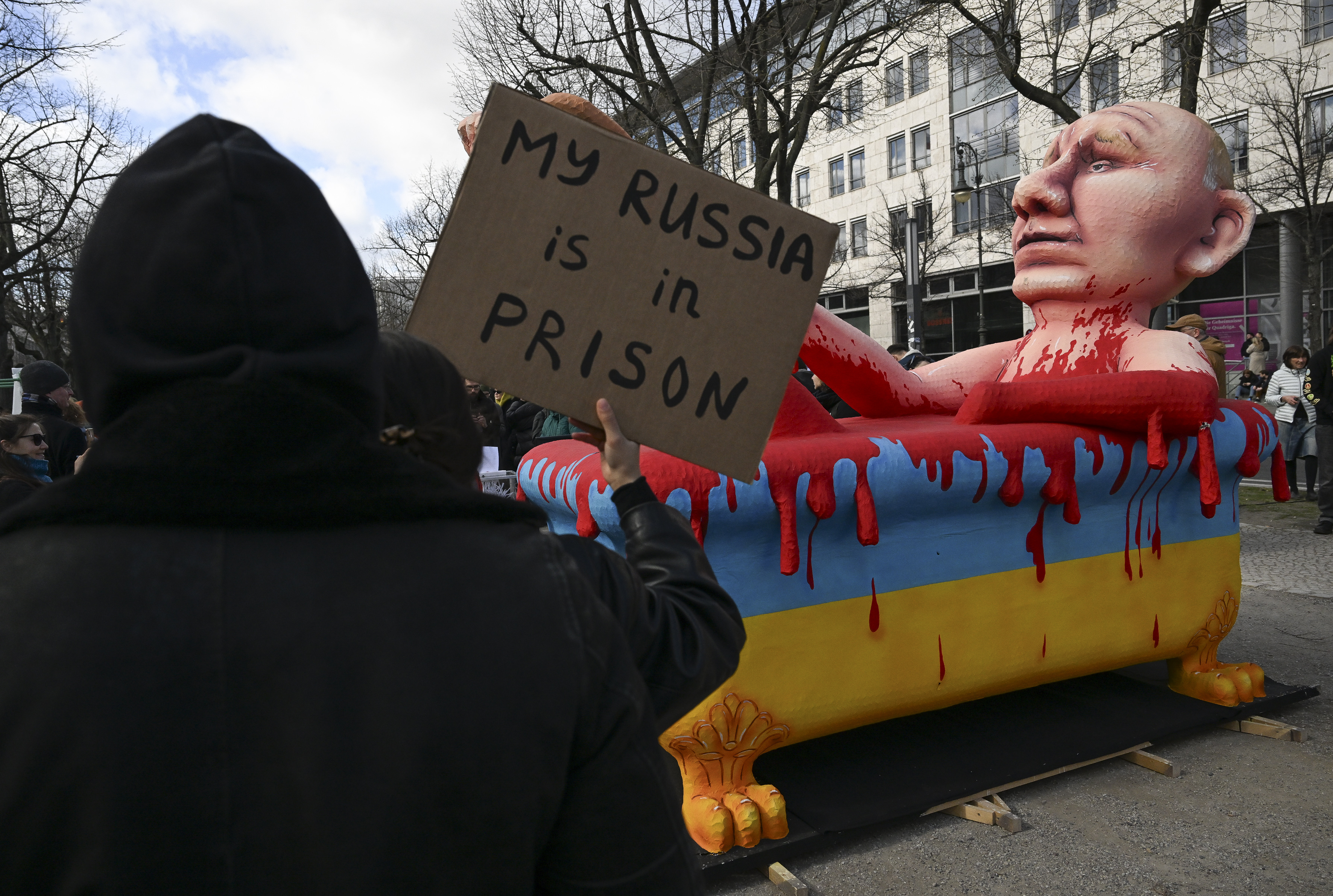 An effigy of Putin bathing in blood near the Russian embassy in Berlin