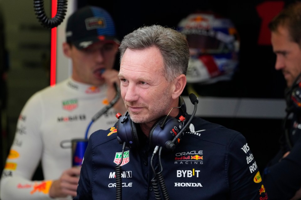 Christian Horner stands in his team garage during the third practice session on Friday