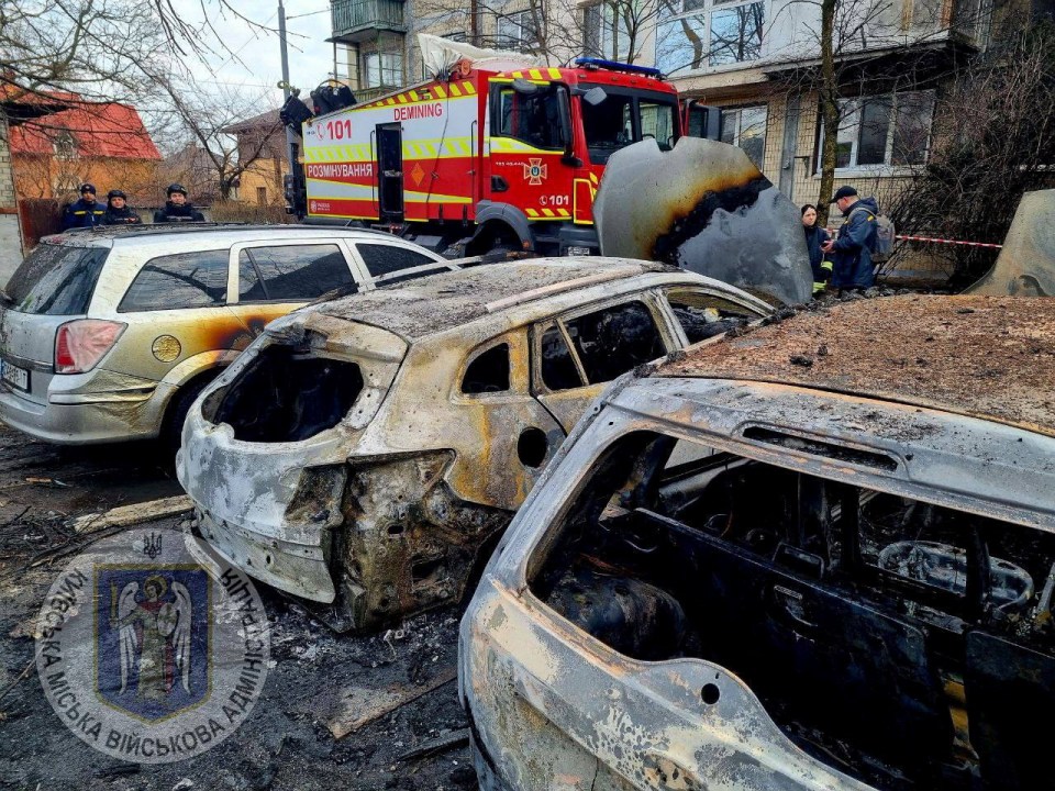 Charred cars lined the streets following the impact of missile debris