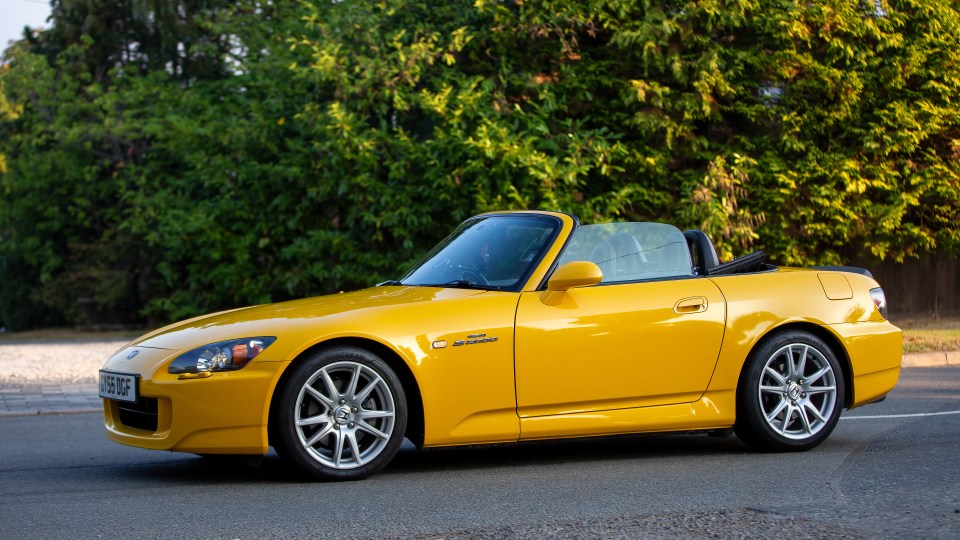 A yellow 1997 Honda S2000