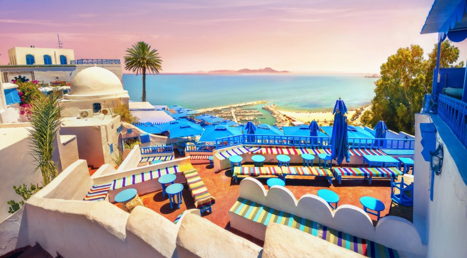 A stunning panoramic view of the sea and cafe terrace in Sidi Bou Said at sunset