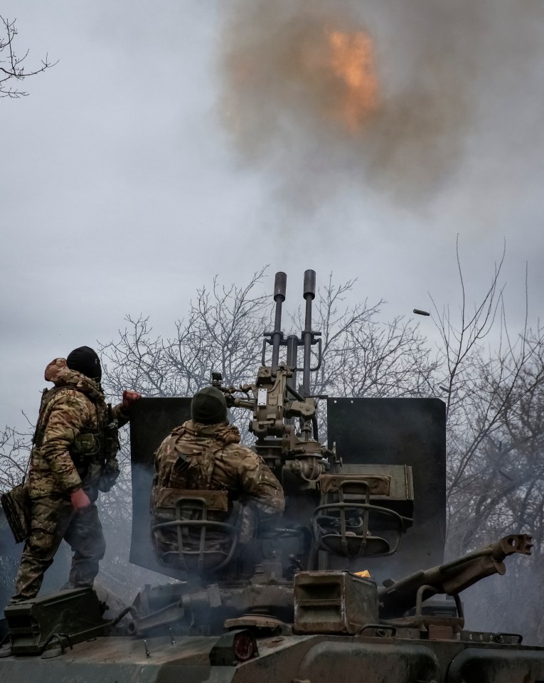 Ukrainian troops fire an anti-aircraft cannon at a frontline near the town of Bakhmut in Ukraine