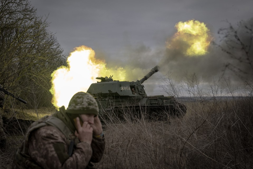 A Ukrainian soldier fires towards Russians in Donetsk