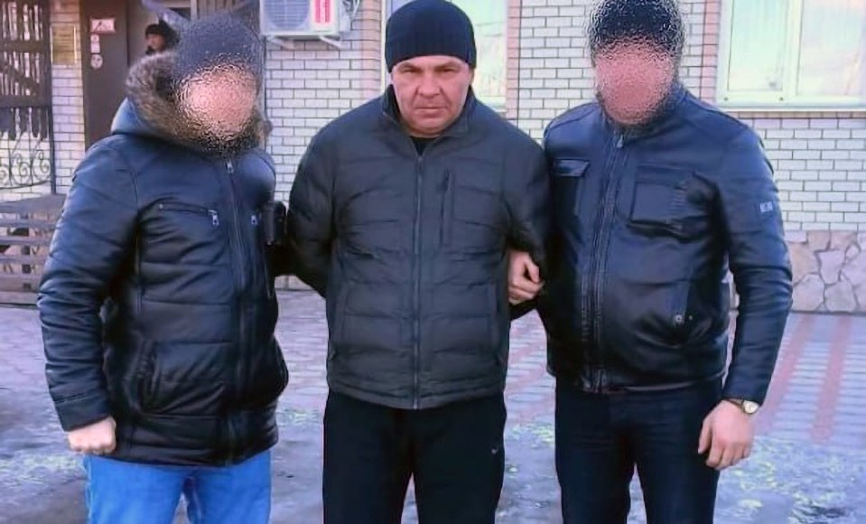 The cannibal killer Gorulenko (middle) has been caught after 10 years on the run