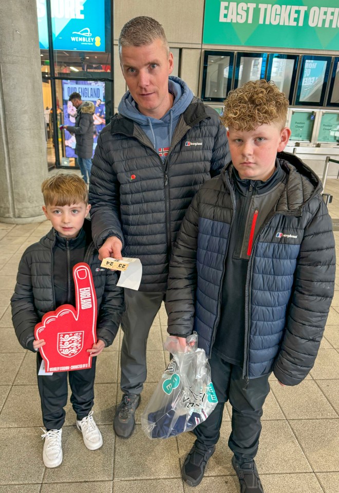 'I’m showing the shirt the red card. They should never have changed the colours', says dad Liam, from Wigan