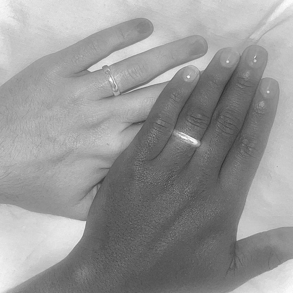 The couple posted a sweet snap of rings on their engagement finger