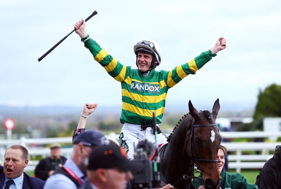 Paul Townend celebrates winning the Grand National on I Am Maximus