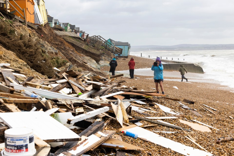 The remnants of smashed-up beach huts in the Hampshire seaside town of Hordle