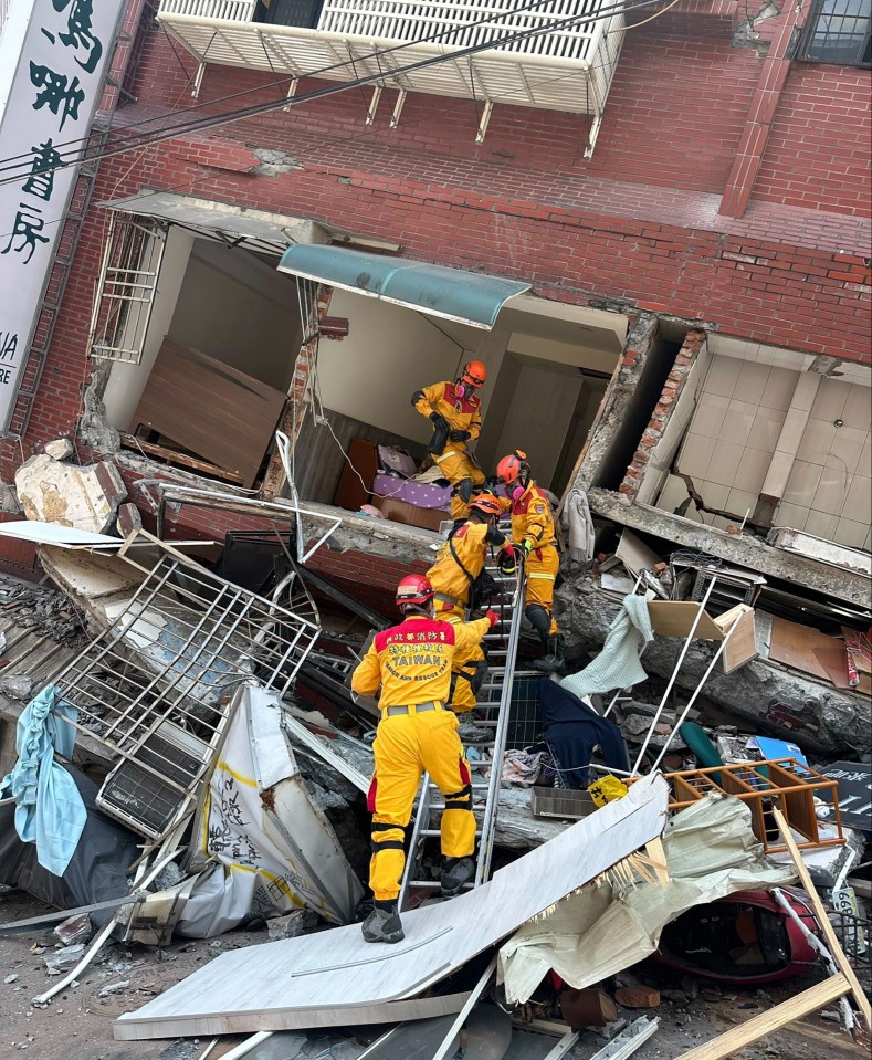 Rescuers search for survivors in a building in Hualien